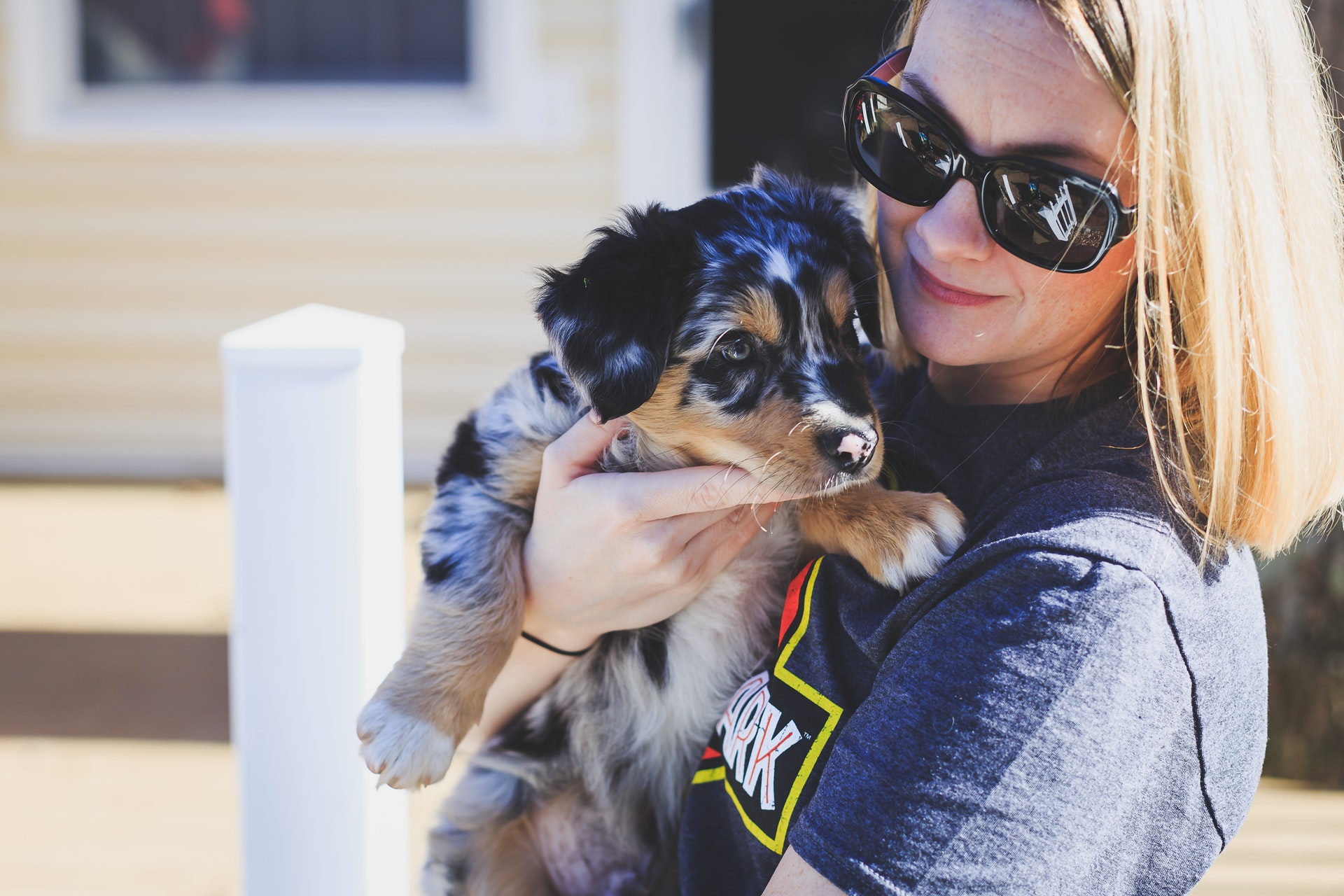 Woman holding a dog, showing how to bond with a new rescue dog